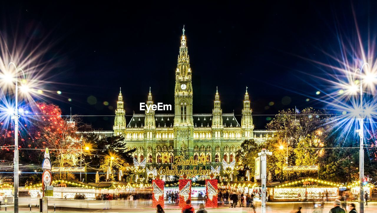 Illuminated vienna town hall against sky at night