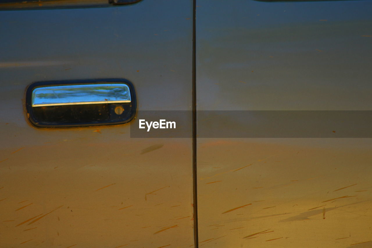 CLOSE-UP VIEW OF YELLOW CAR