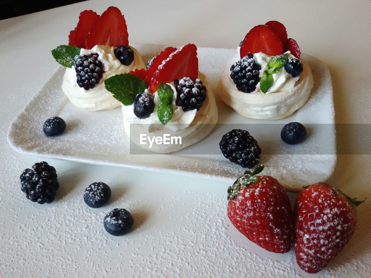 CLOSE-UP OF STRAWBERRIES SERVED ON PLATE