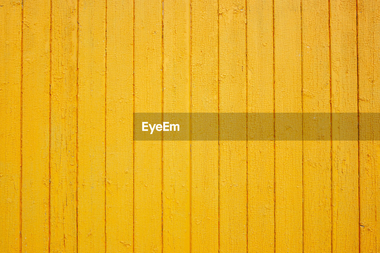 DIRECTLY ABOVE SHOT OF YELLOW WOODEN WALL