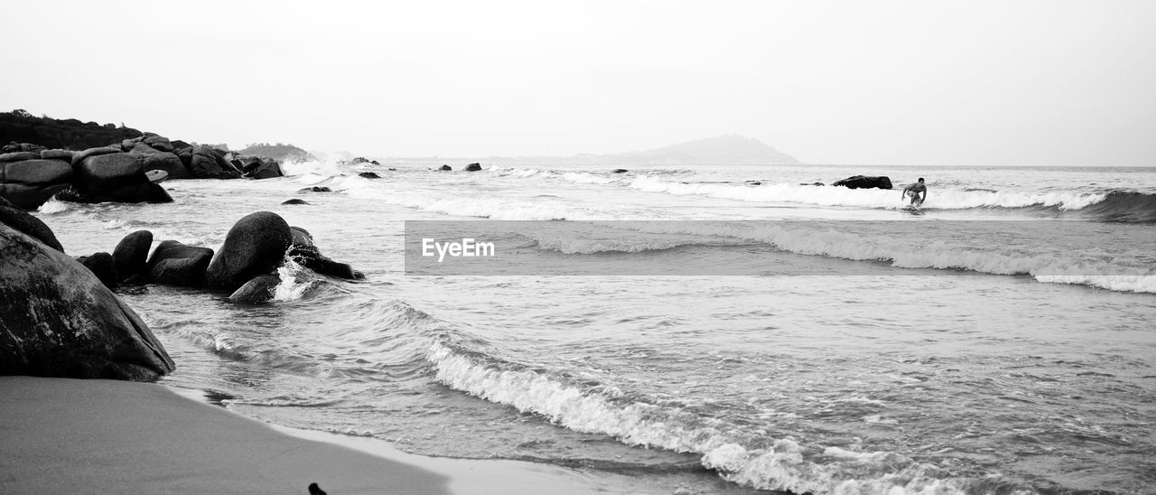 Scenic view of beach against clear sky