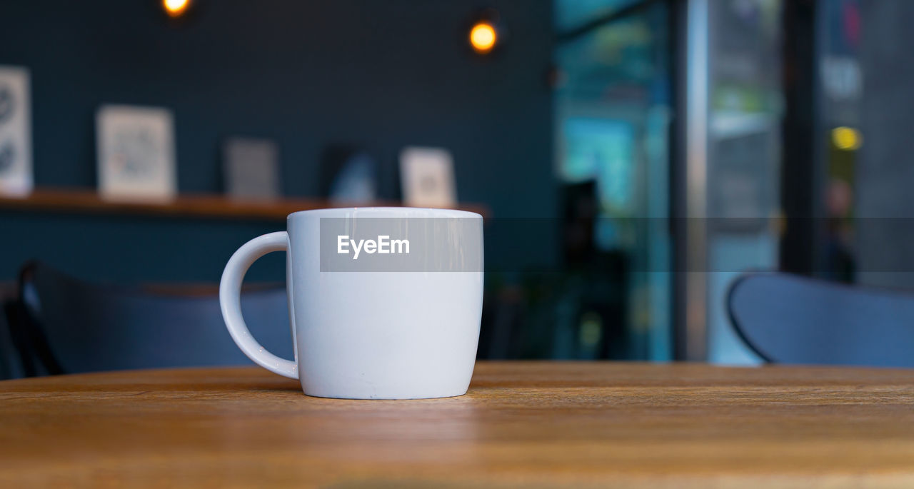 Close-up of coffee cup on table