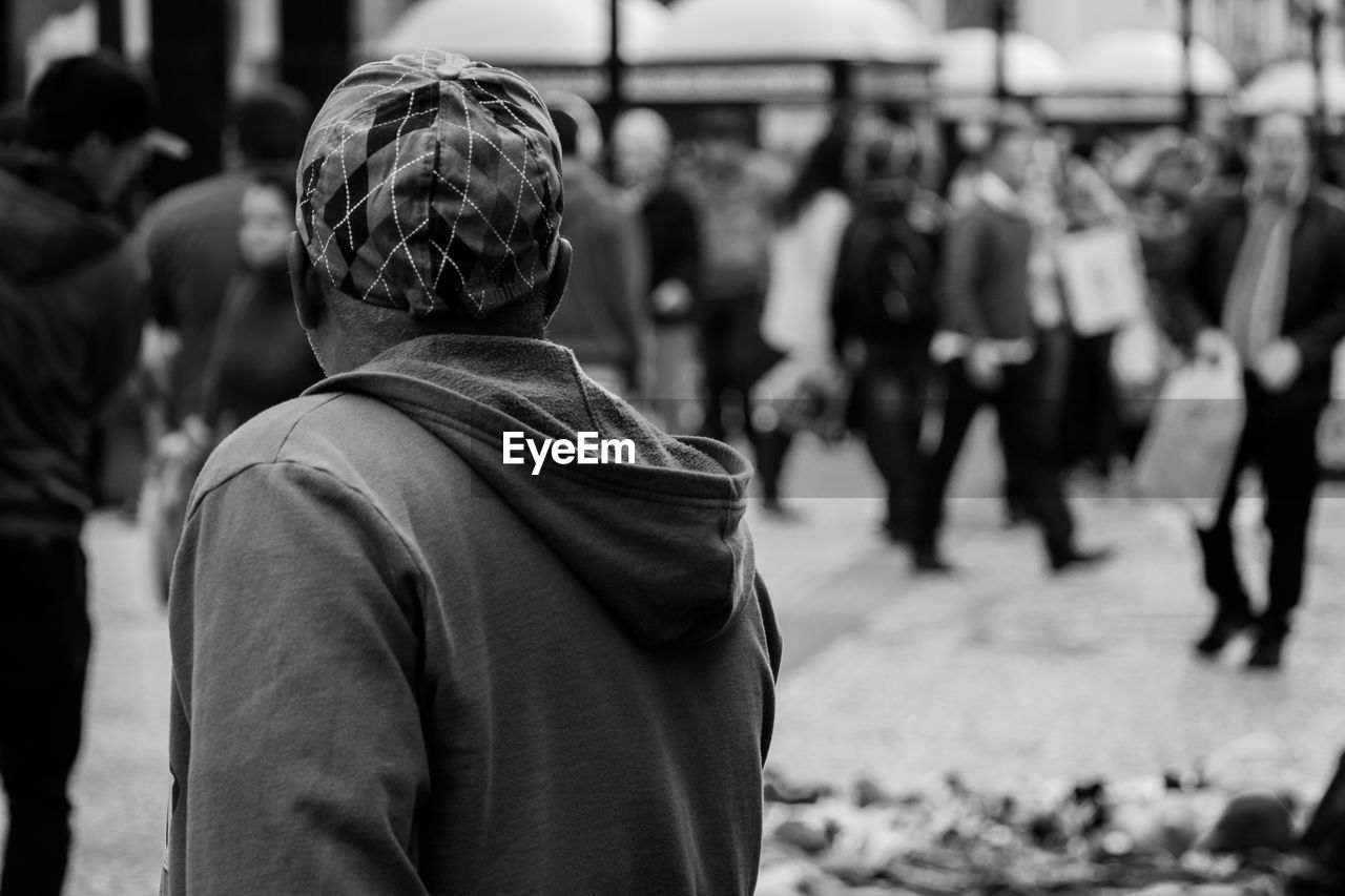 Rear view of man standing on street