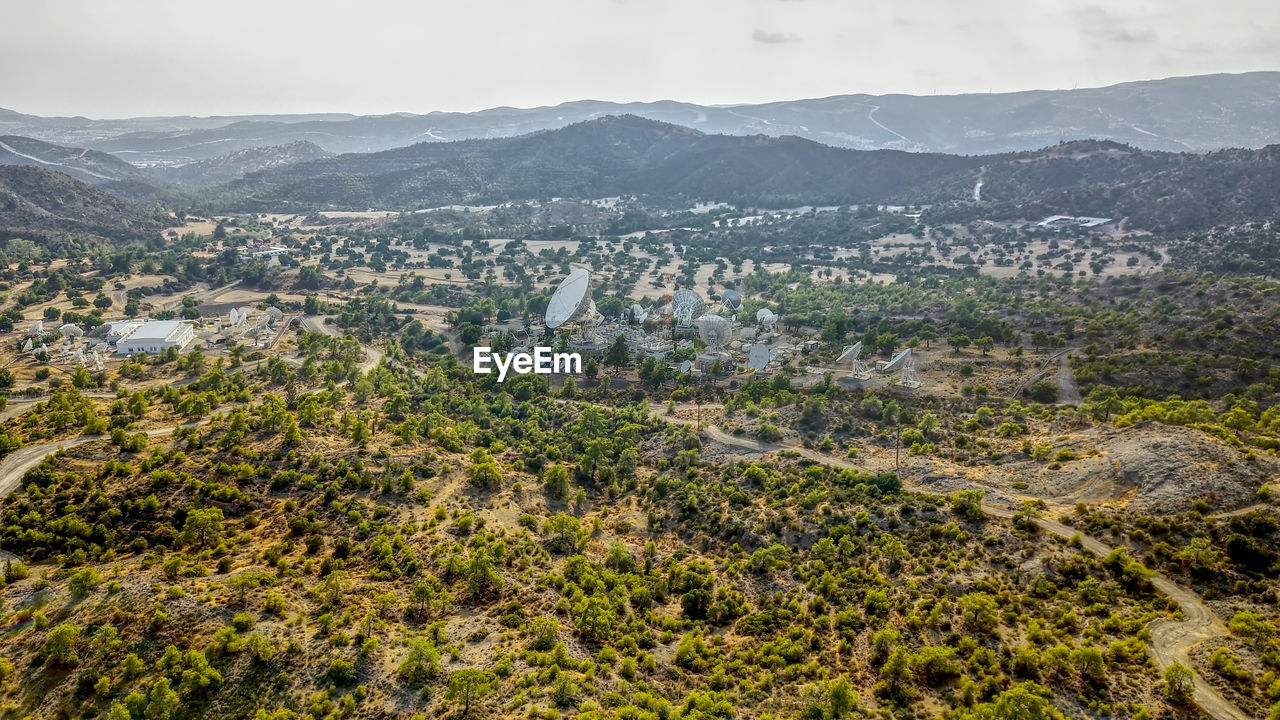 High angle view of plants and buildings in city