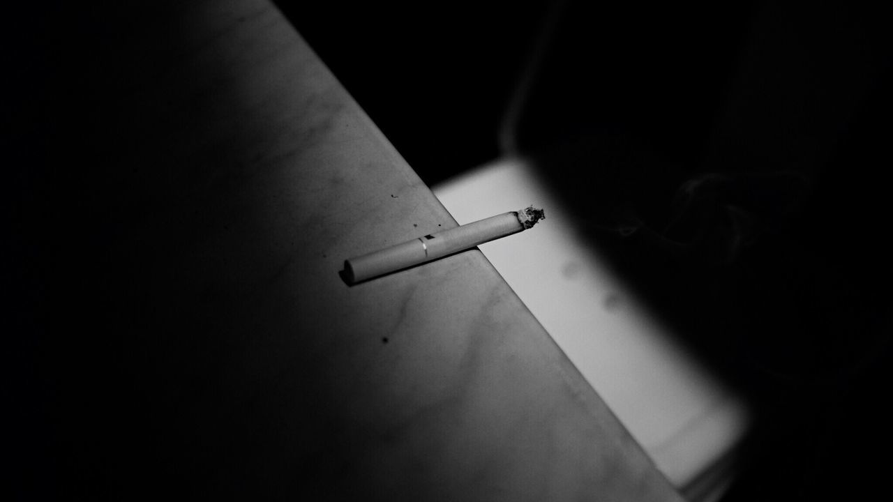 Close-up of cigarette on counter