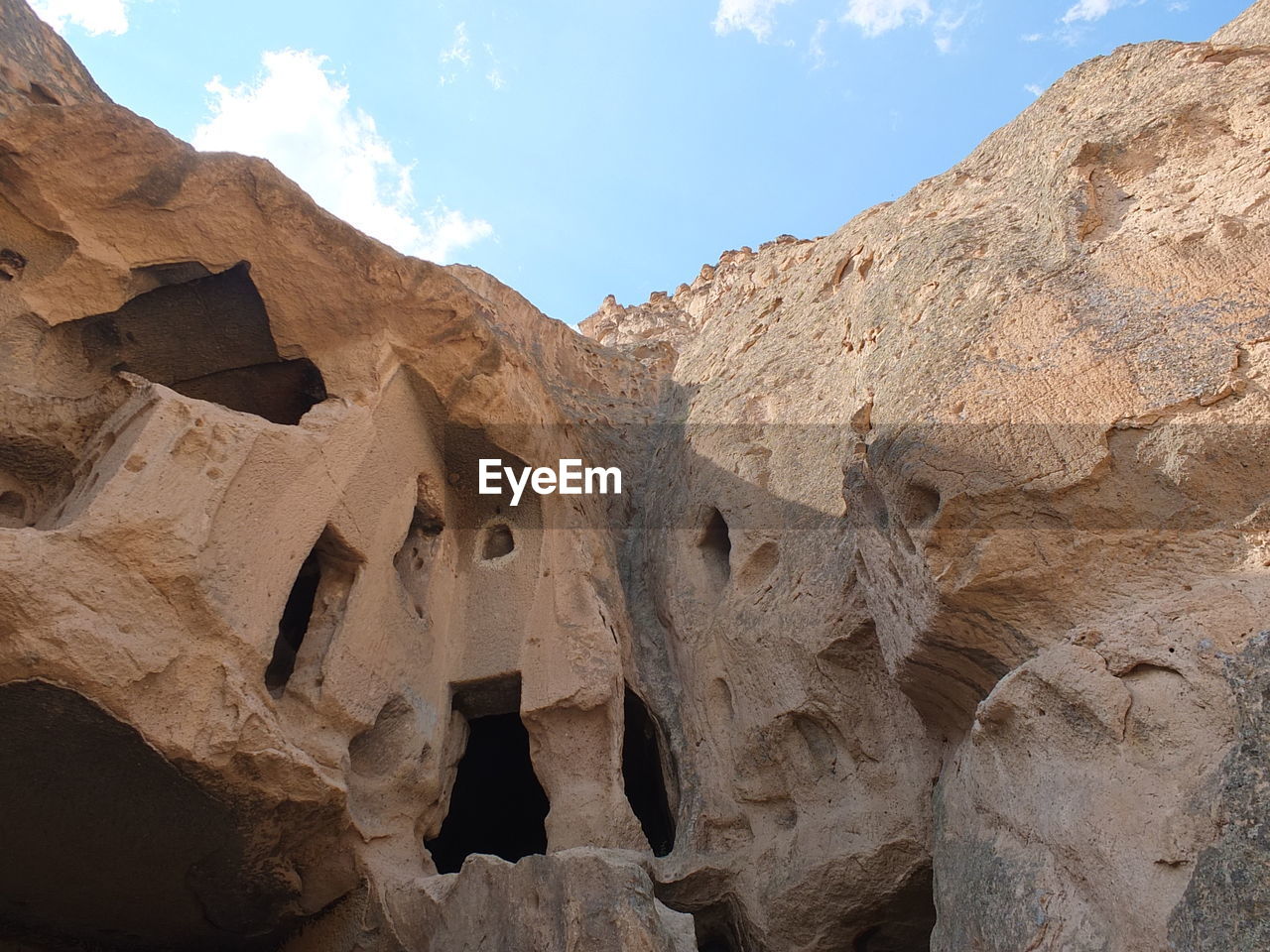 LOW ANGLE VIEW OF ROCK FORMATION