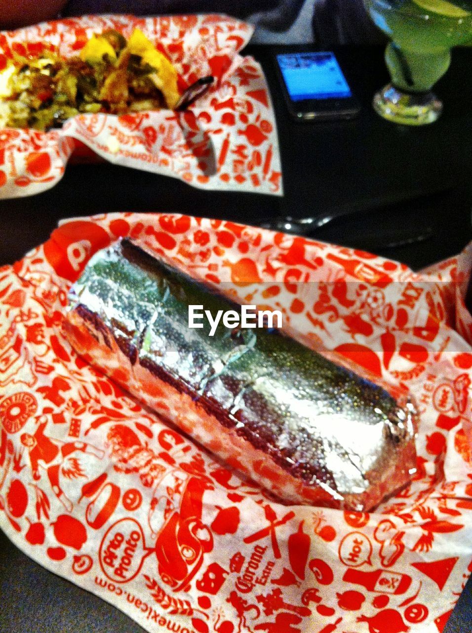 CLOSE-UP OF RED OBJECT ON TABLE