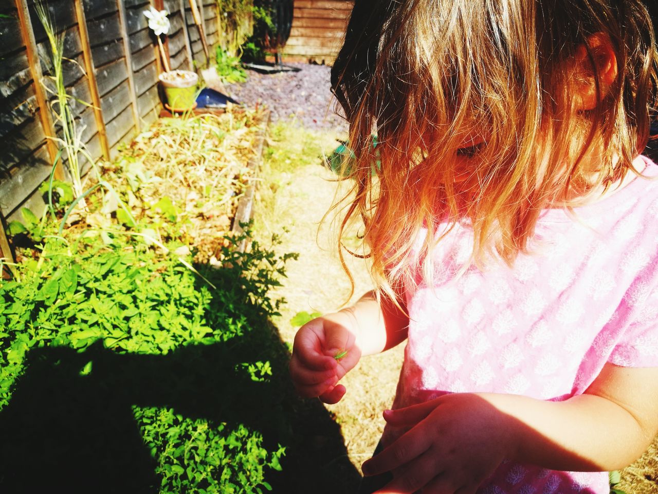 HIGH ANGLE VIEW OF WOMAN HOLDING GIRL