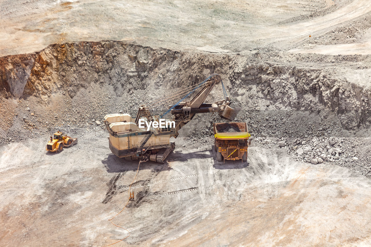 Electric rope shovel loading a dump truck at a copper mine in peru