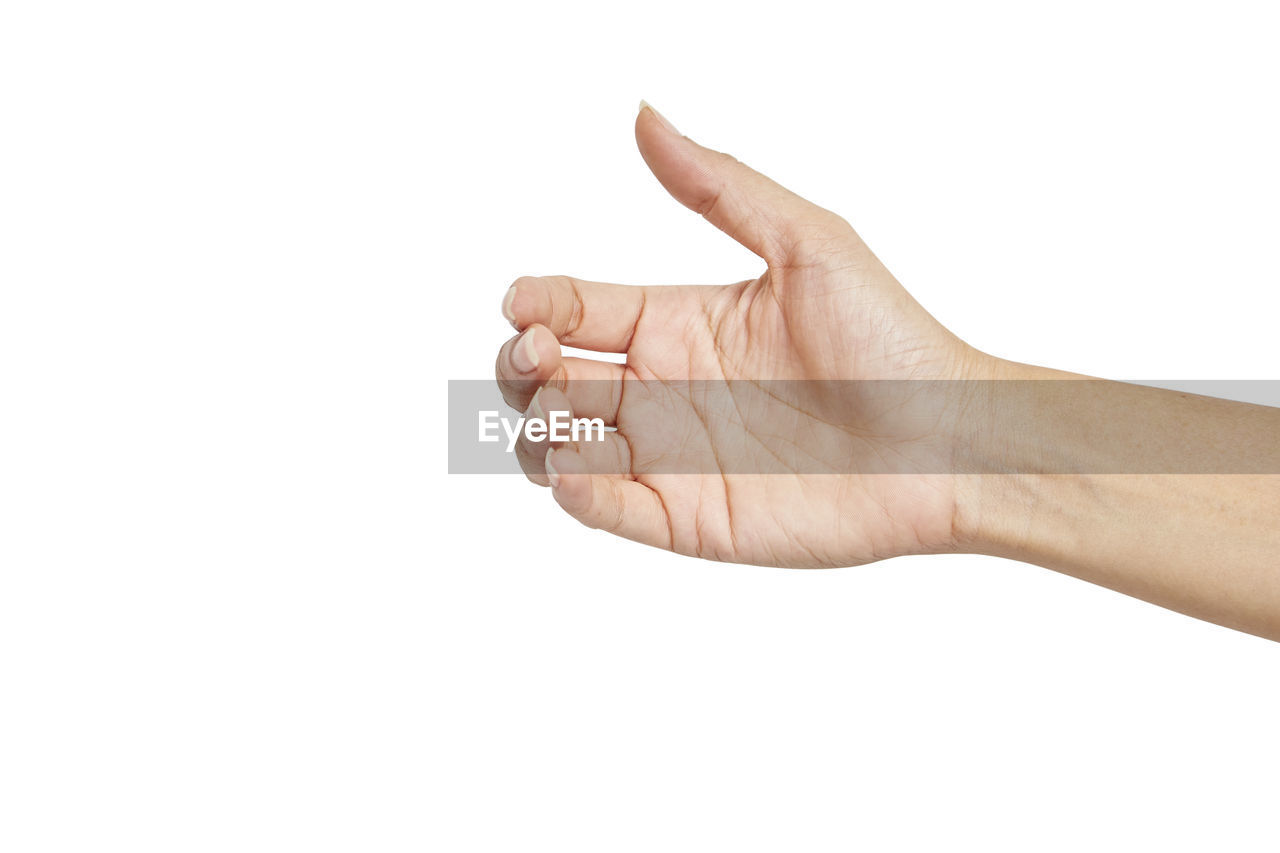 Close-up of hand gesturing against white background