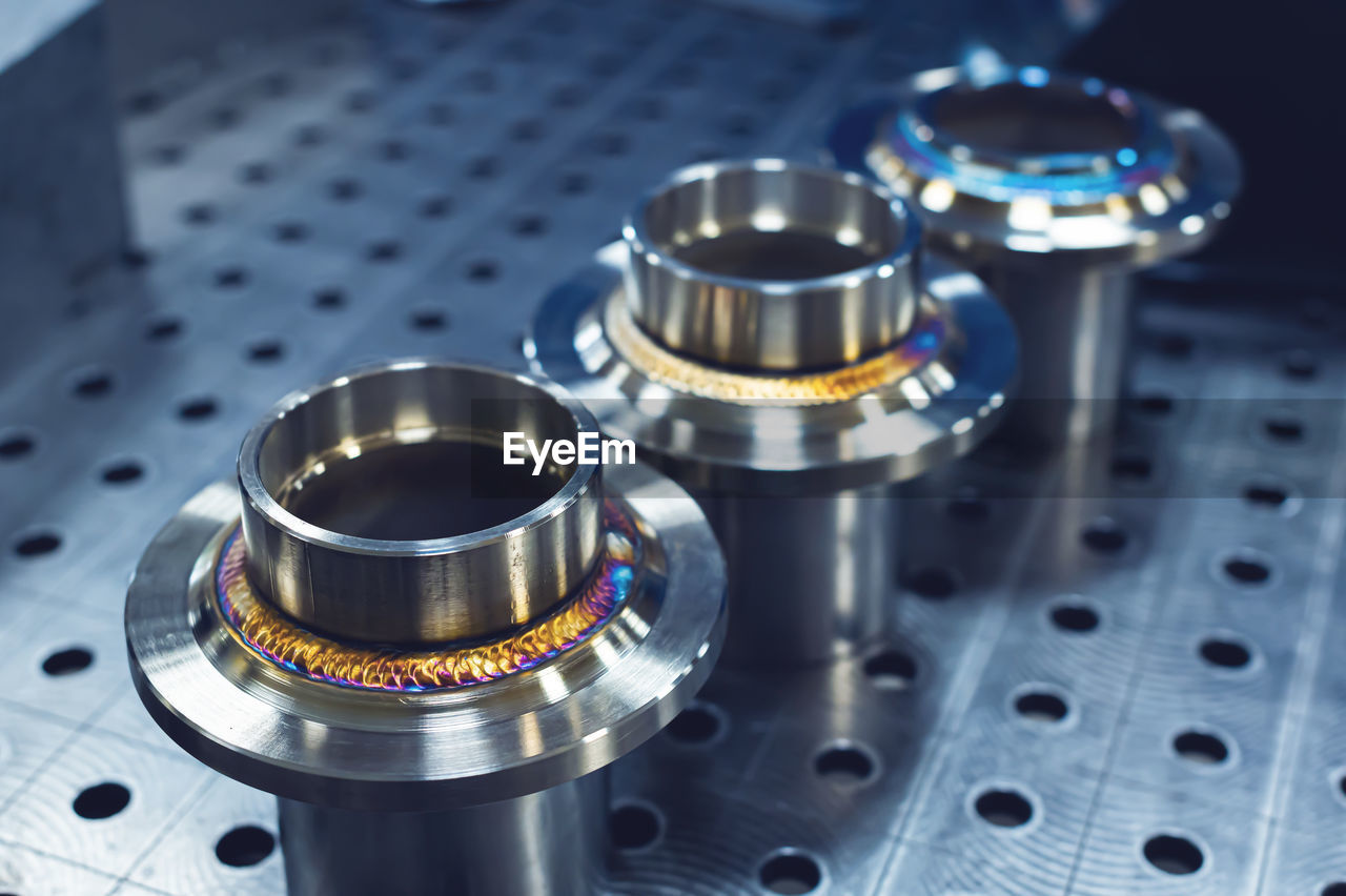 New freshly welded stainless steel flanges. demonstration of reference multi-colored seams