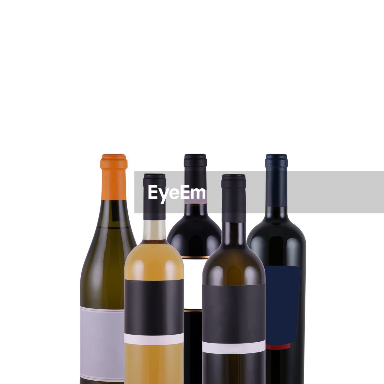 Assorted bottles of wine on white background