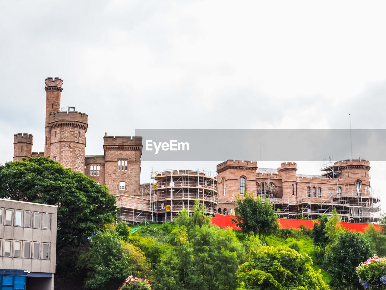 architecture, building exterior, built structure, city, landmark, sky, cityscape, building, plant, nature, tree, urban area, town, travel destinations, cloud, history, skyline, the past, no people, travel, residential district, outdoors, downtown, day, tourism, house, neighbourhood