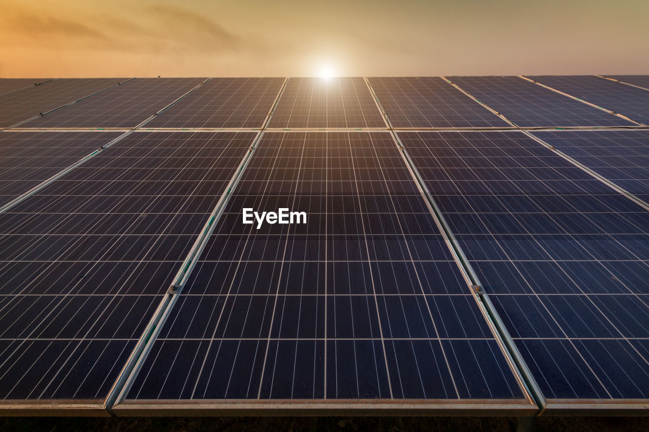 Low angle view of solar panels against sky