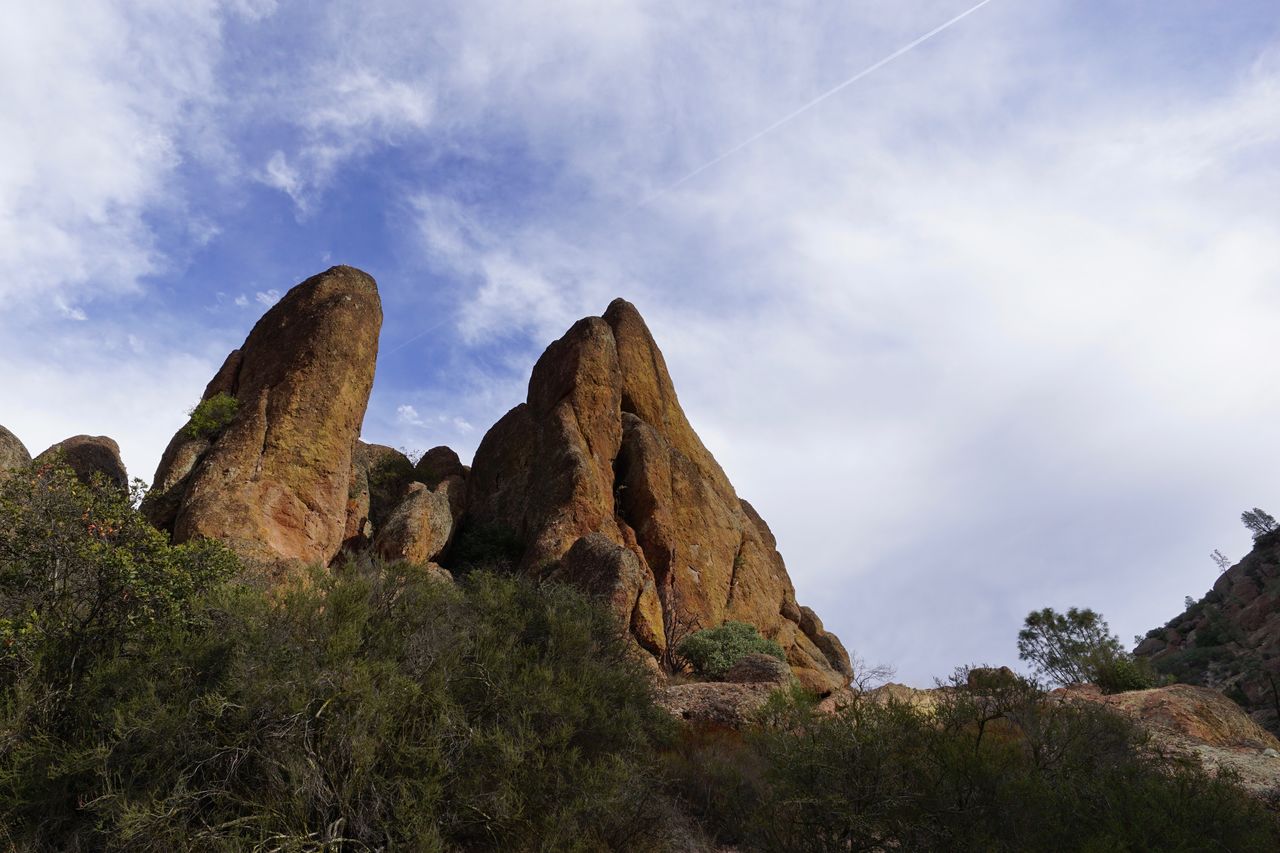 Low angle view of rock formation against sky