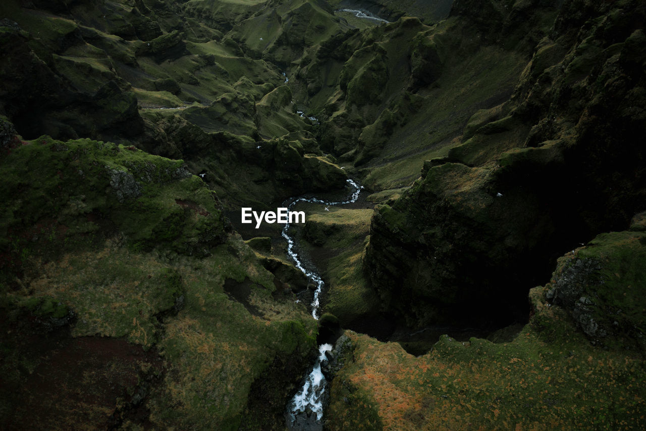 WATER FLOWING THROUGH ROCKS