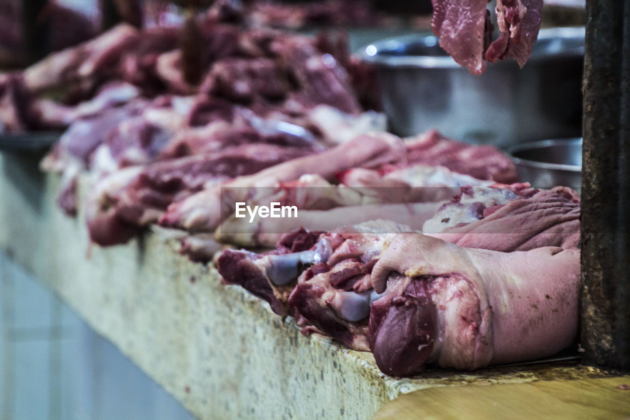 CLOSE-UP OF MEAT FOR SALE AT MARKET STALL