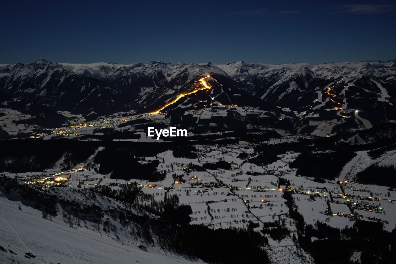 Scenic view of mountains against sky during winter