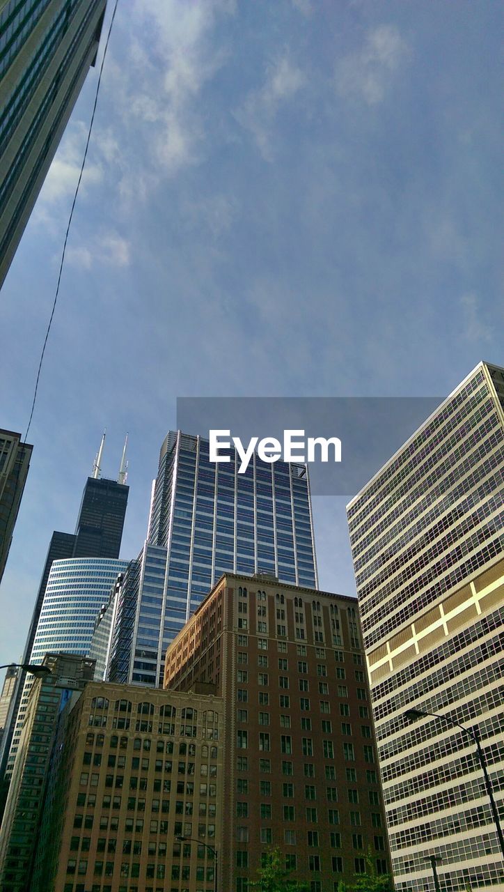 Low angle view of skyscrapers against sky