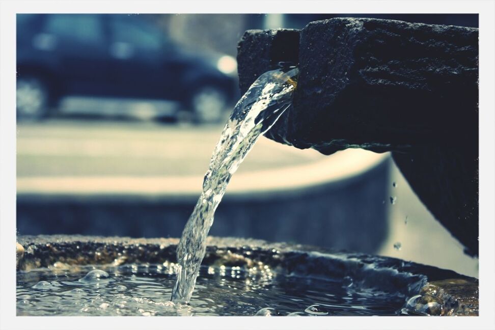 CLOSE-UP OF WATER DROPS ON TABLE