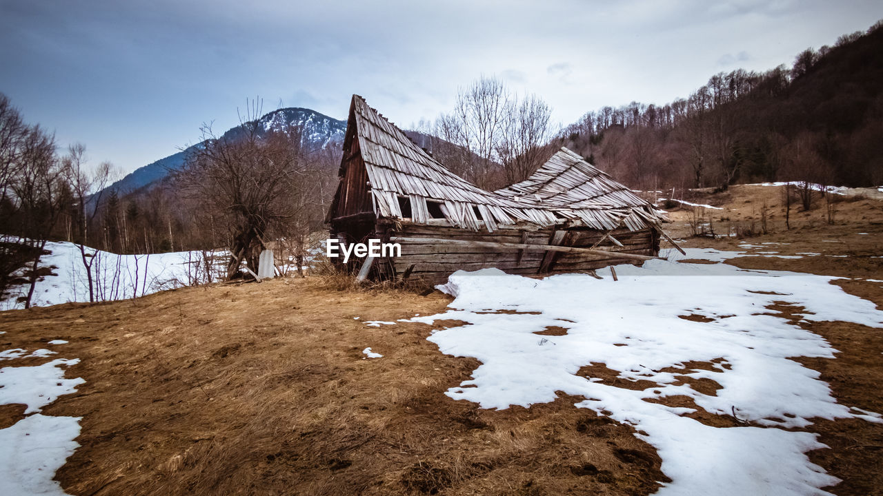 Demolished old wooden hut somewhere in the retezat mountains. desolated, abandoned places.