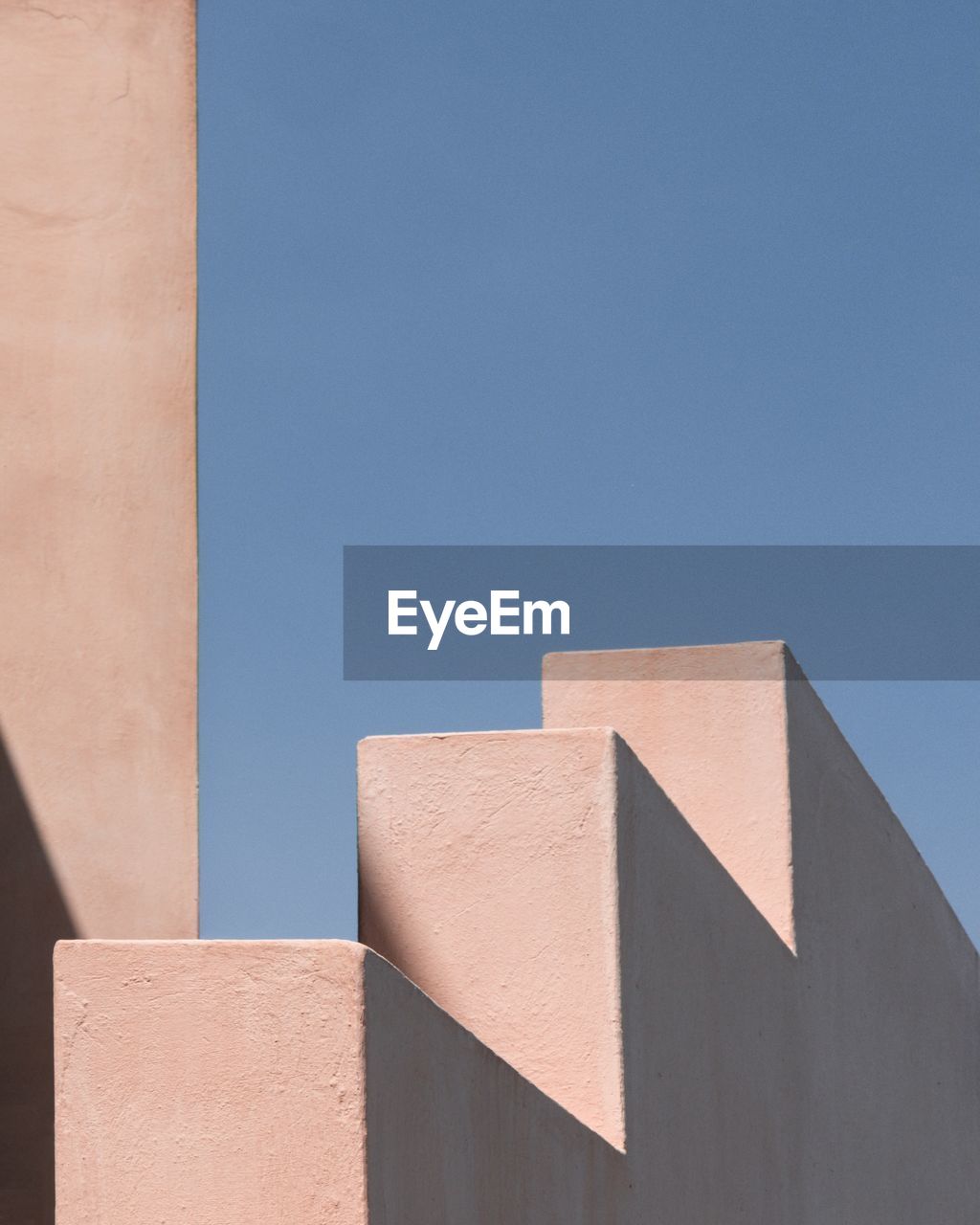 Low angle view of building against clear blue sky