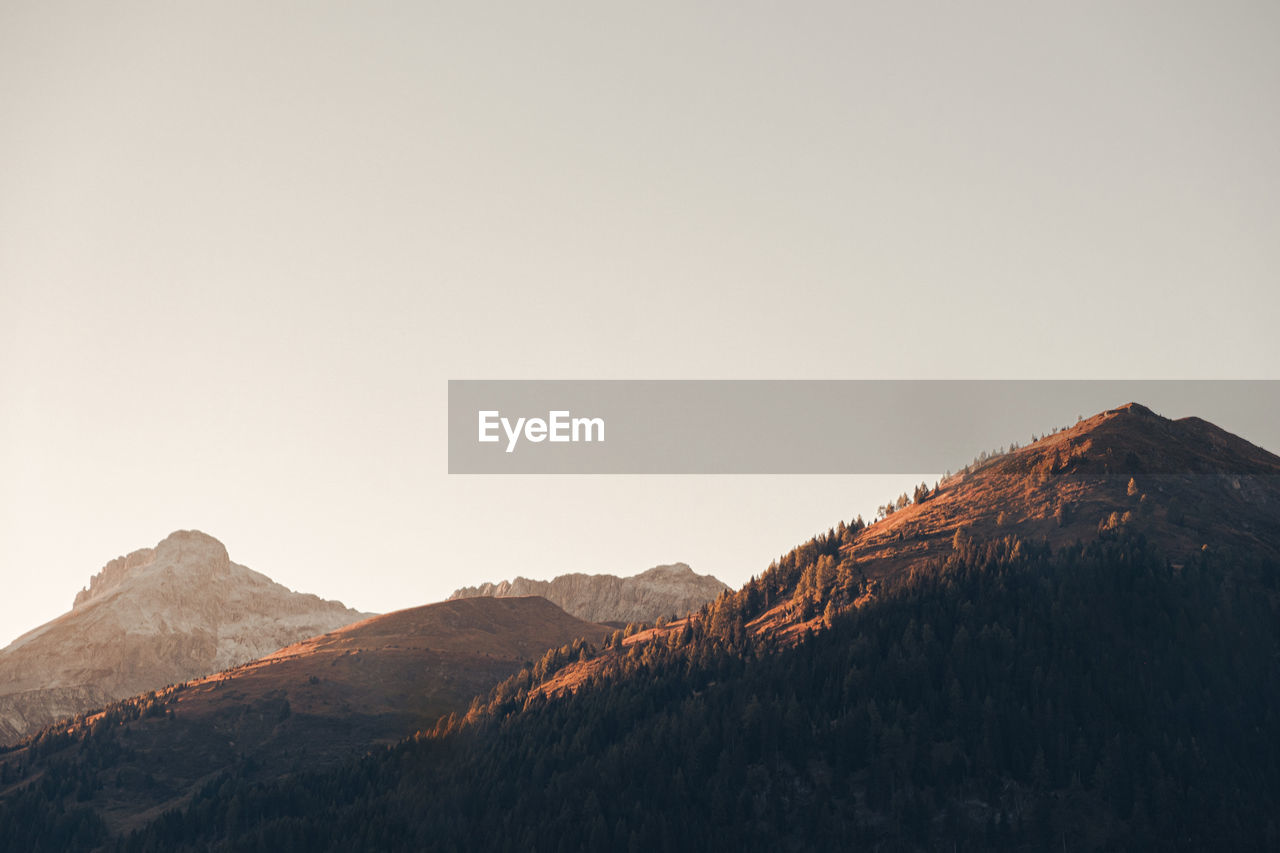 Minimalist landscape austrian alps sunset view from a passenger seat on a road trip