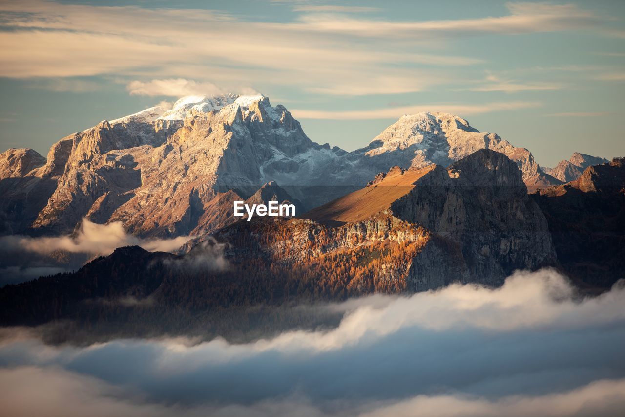 scenic view of snowcapped mountains against sky at sunset