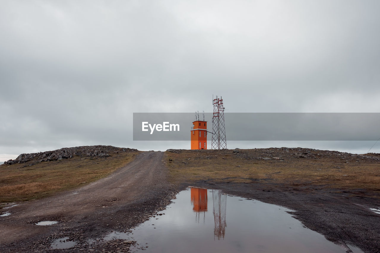 VIEW OF LIGHTHOUSE BY LAND AGAINST SKY