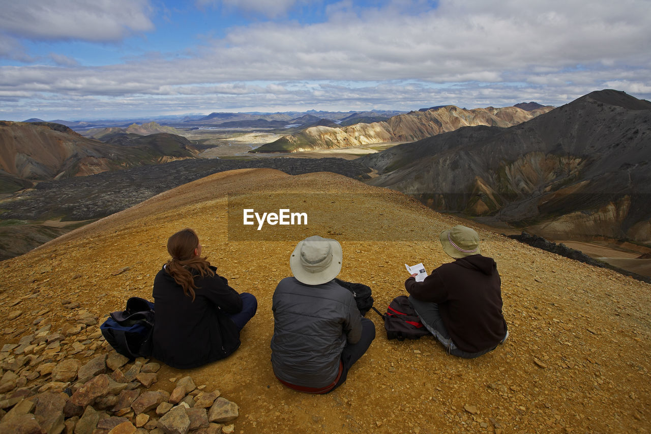 Three friends admiring the view in landmannalaugar