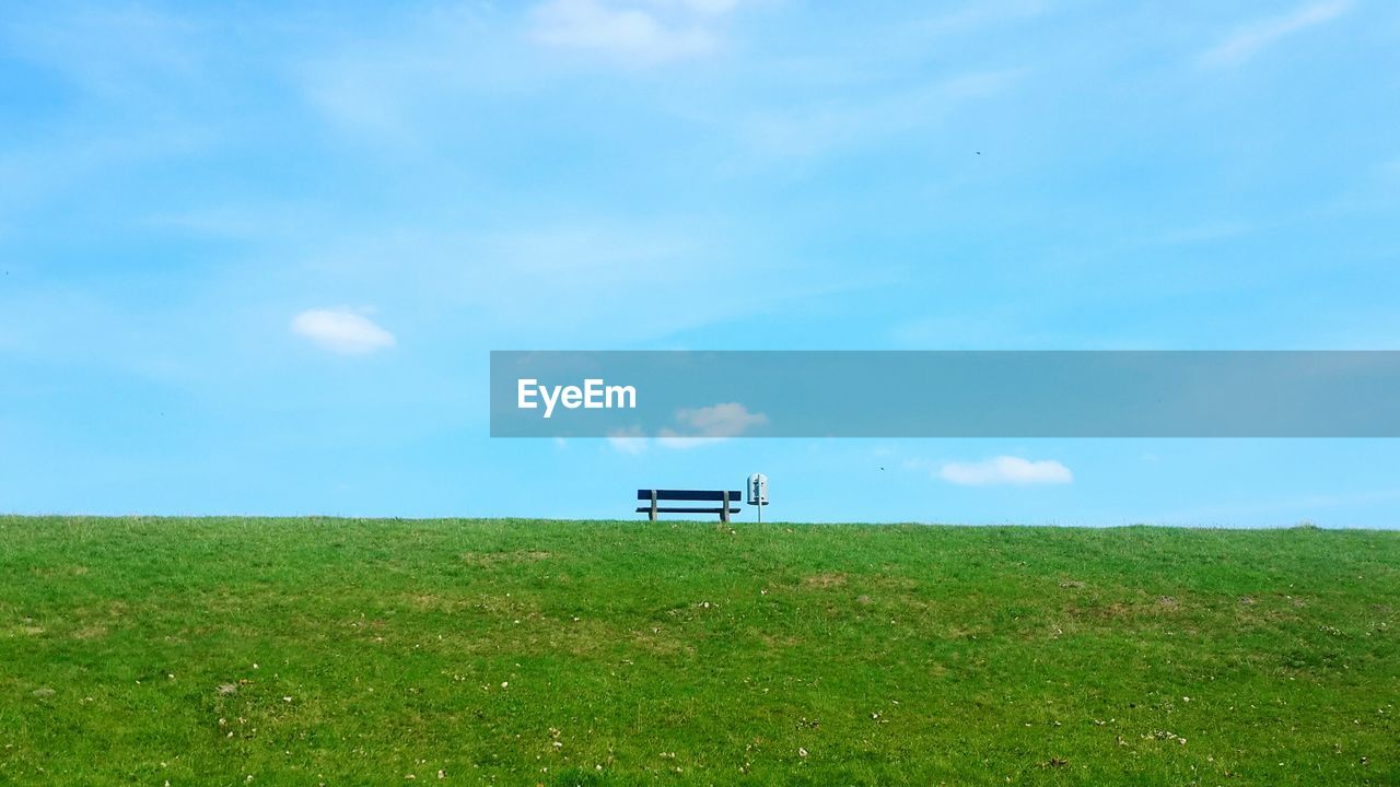 Built structure on field against sky