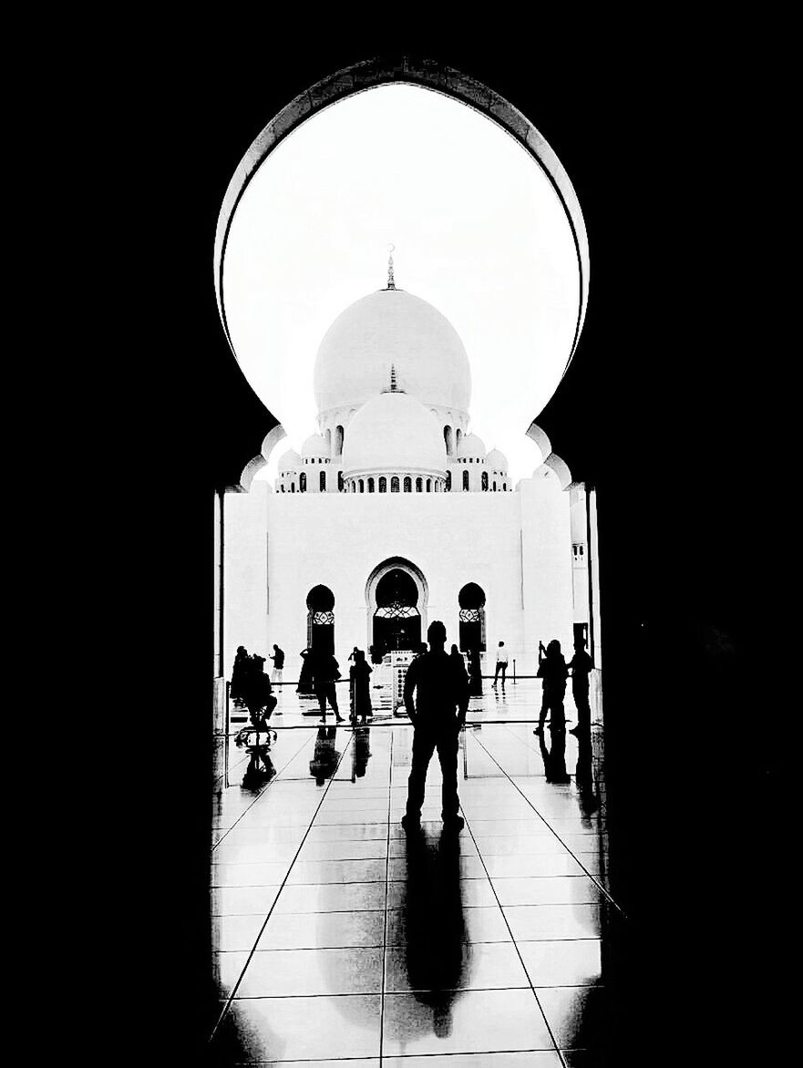 SILHOUETTE OF PEOPLE IN A MONUMENT