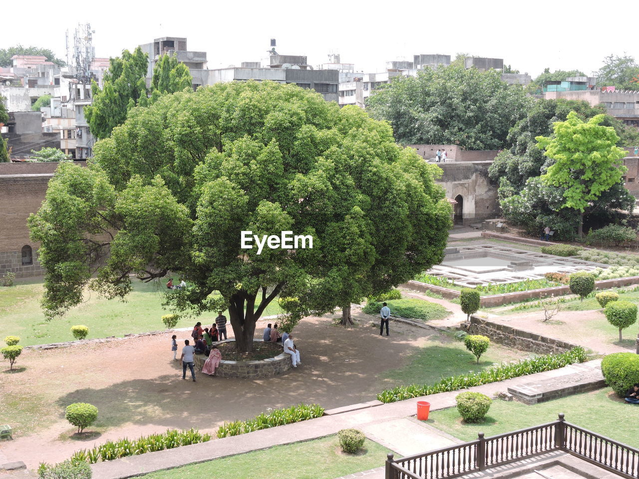 PEOPLE IN PARK AGAINST CITY IN SKY