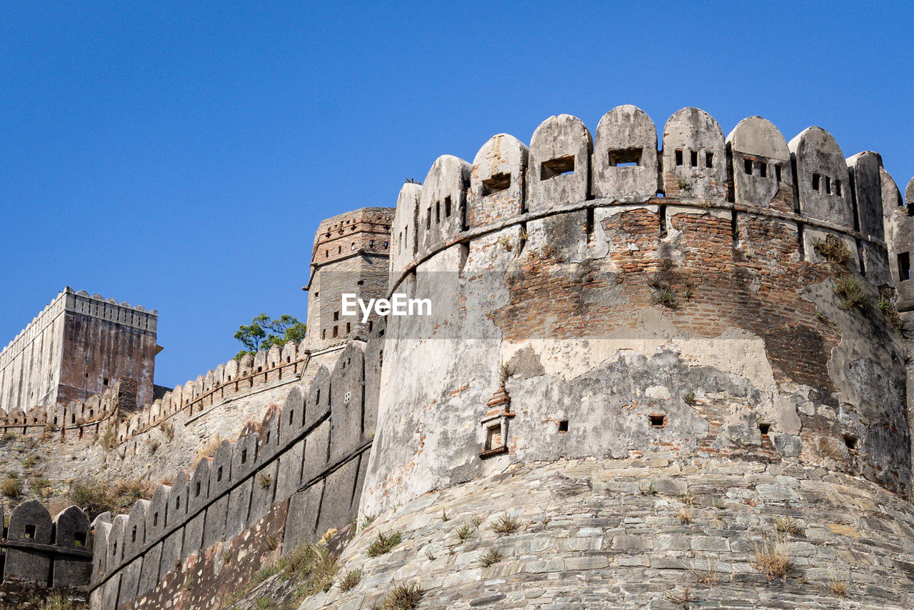 Ancient fort wall ruins with bright blue sky at morning