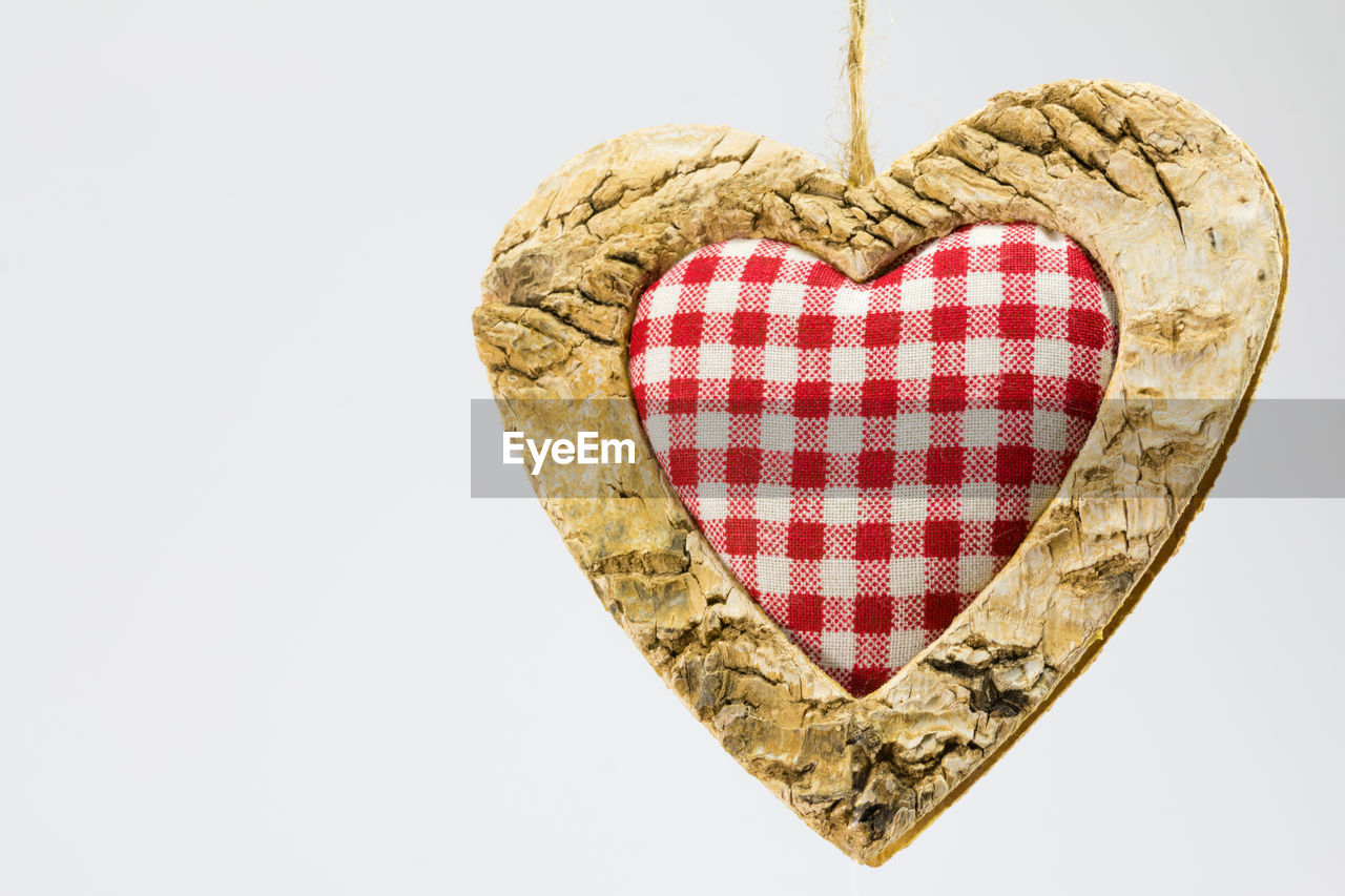 Close-up of heart shape against white background