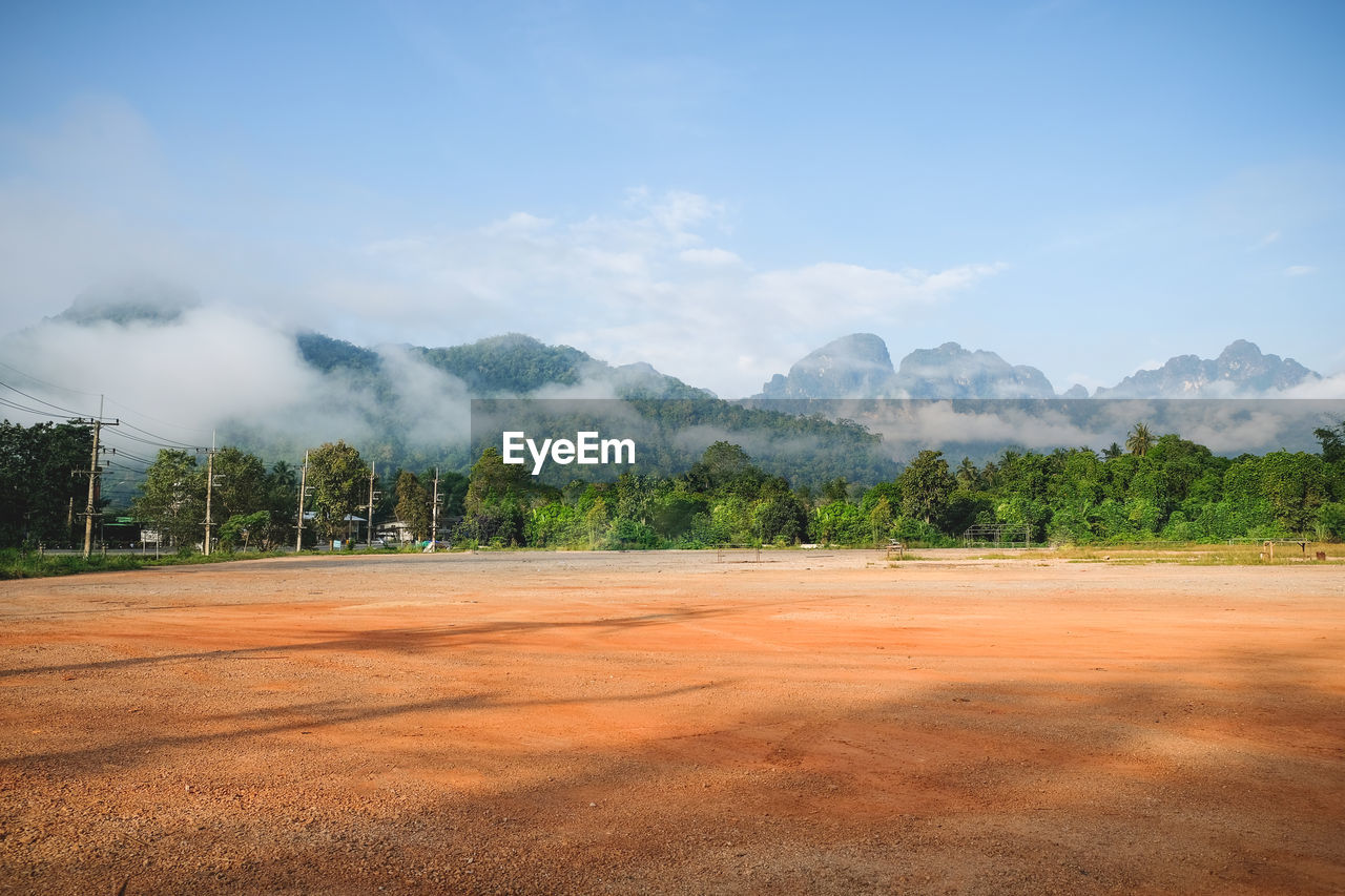 Scenic view of landscape against blue sky