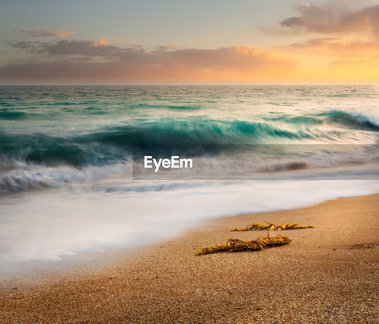 SCENIC VIEW OF SEA DURING SUNSET