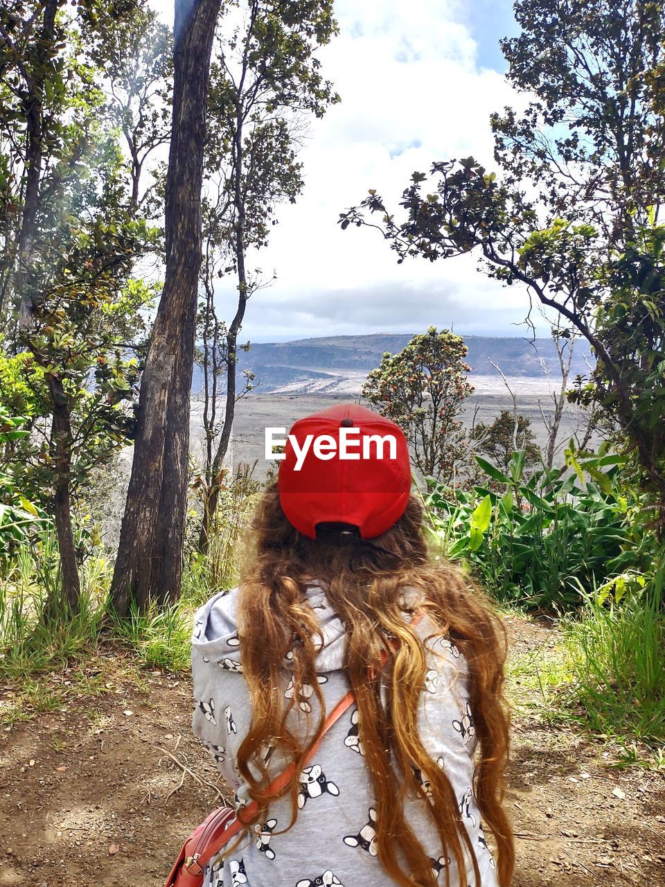 Girl viewing kilauea iki from hiking trail