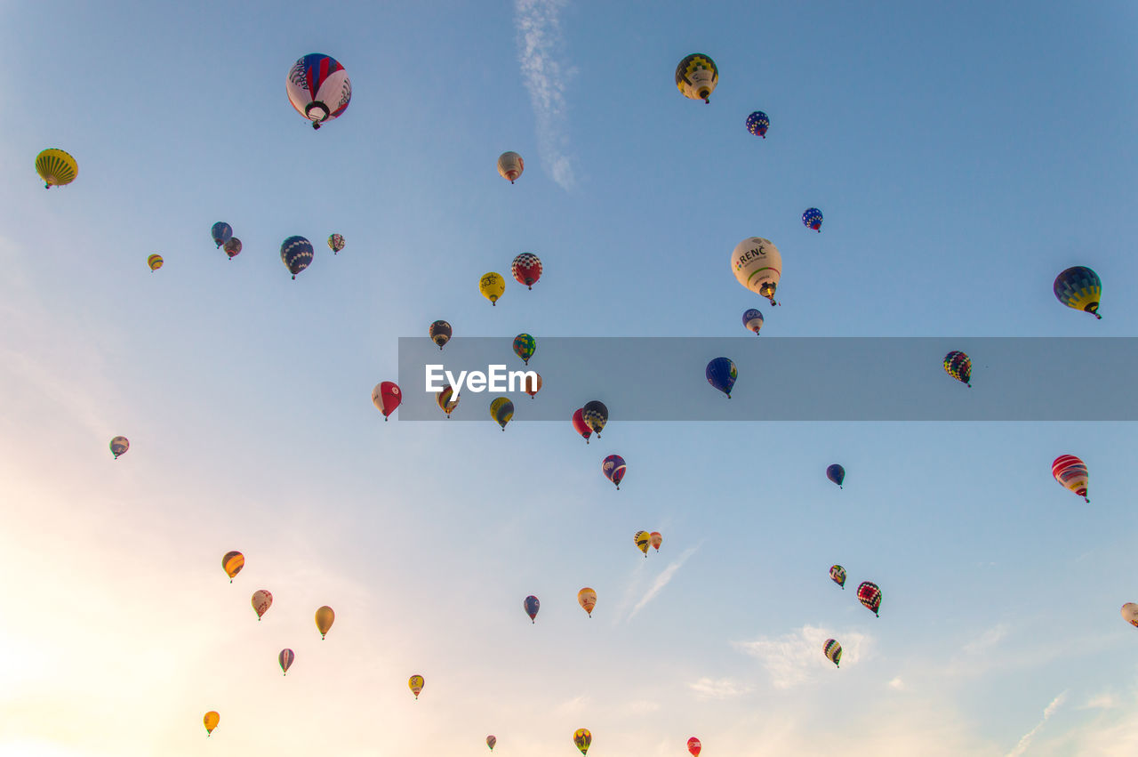 LOW ANGLE VIEW OF HOT AIR BALLOONS IN SKY