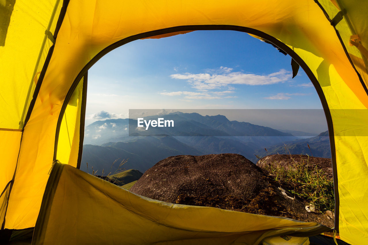 Scenic view of mountains seen through window