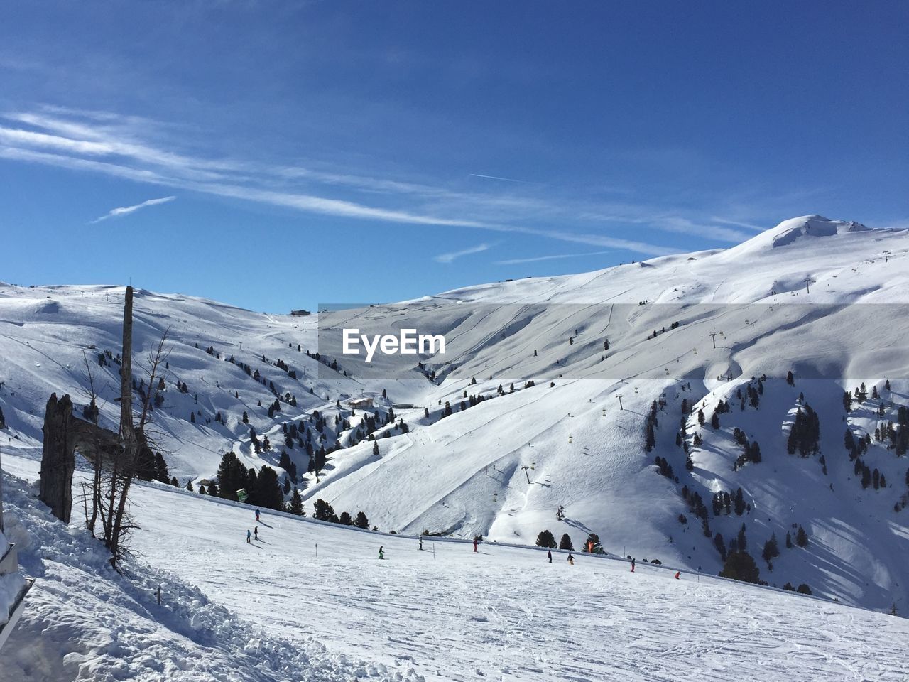 GROUP OF PEOPLE ON SNOWCAPPED MOUNTAIN