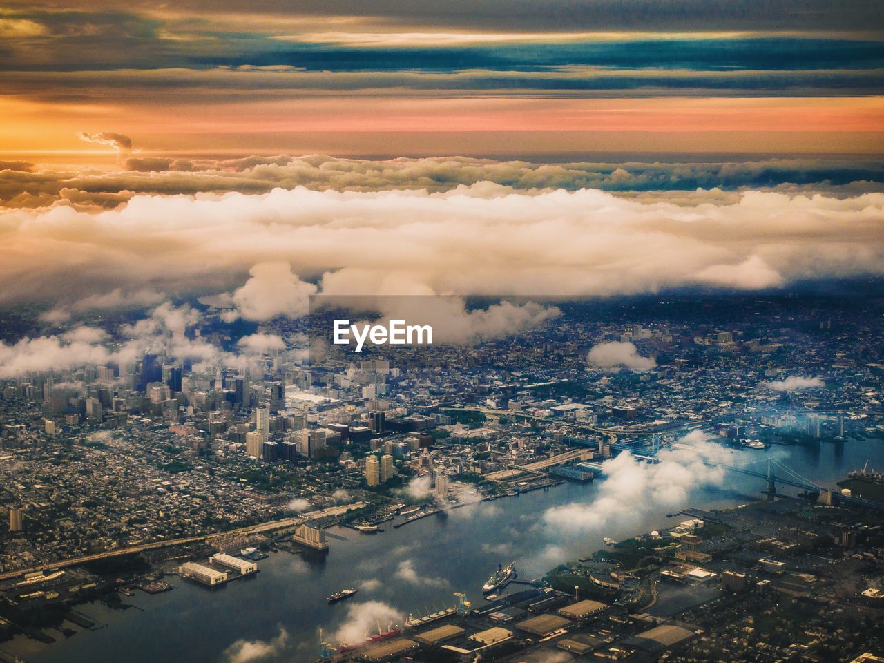 Cityscape and river against sky