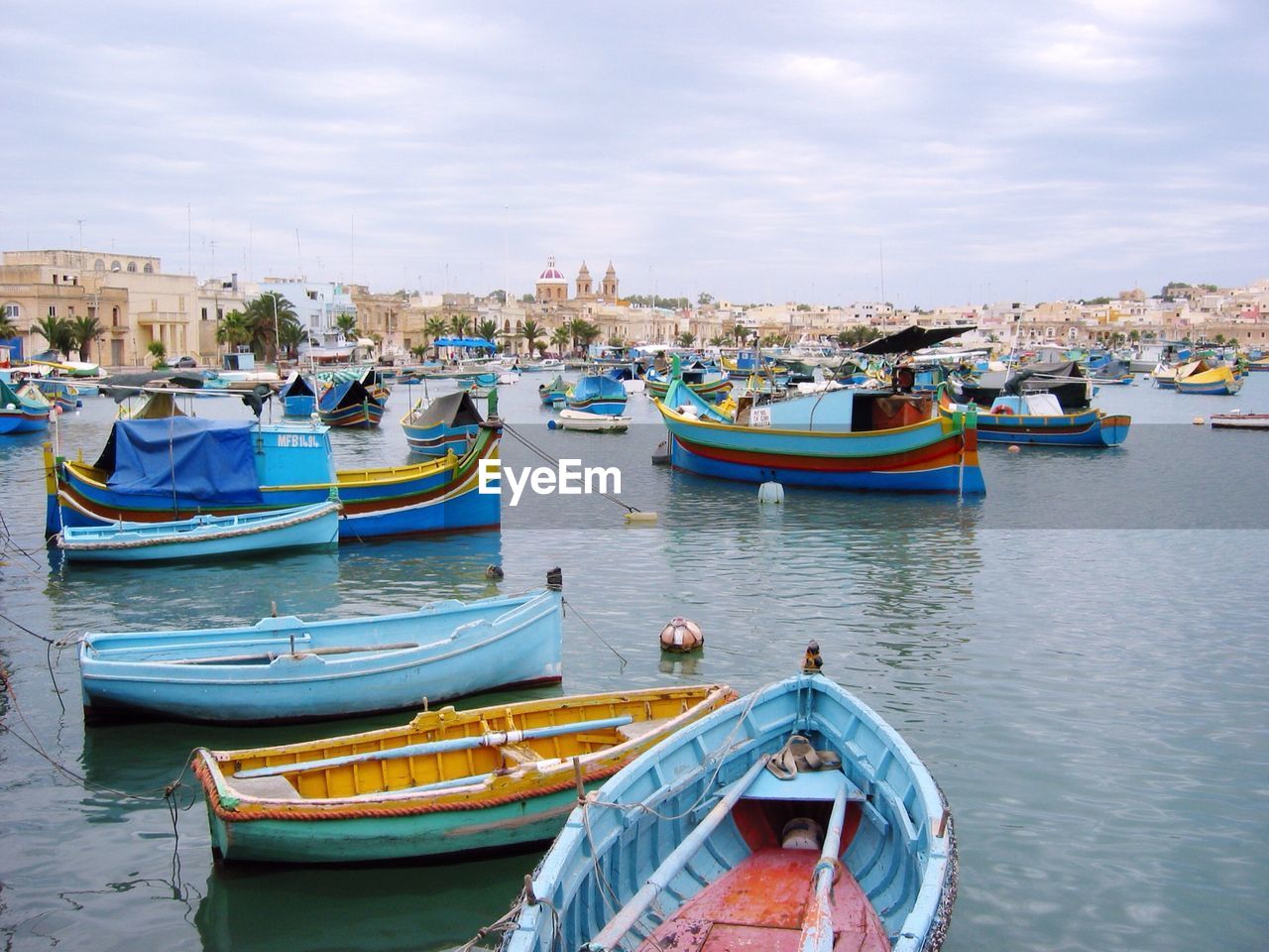 Boats moored at harbor