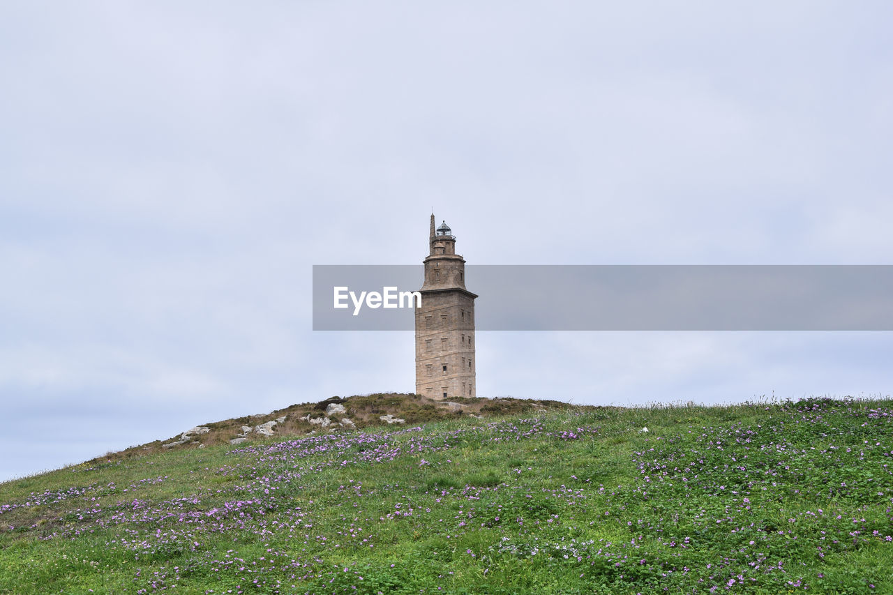 View of the hercules tower. ancient roman lighthouse in the city of a coruña - spain