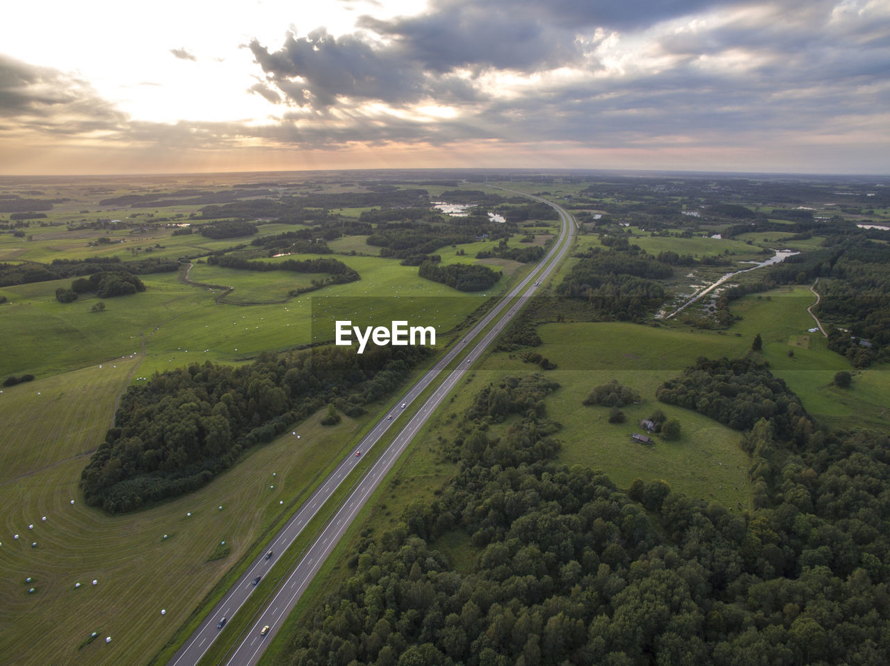 HIGH ANGLE VIEW OF ROAD AMIDST LAND AGAINST SKY