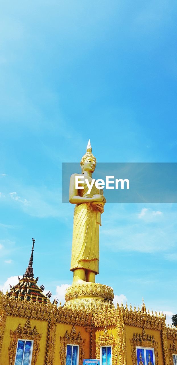 LOW ANGLE VIEW OF STATUE AGAINST BLUE SKY