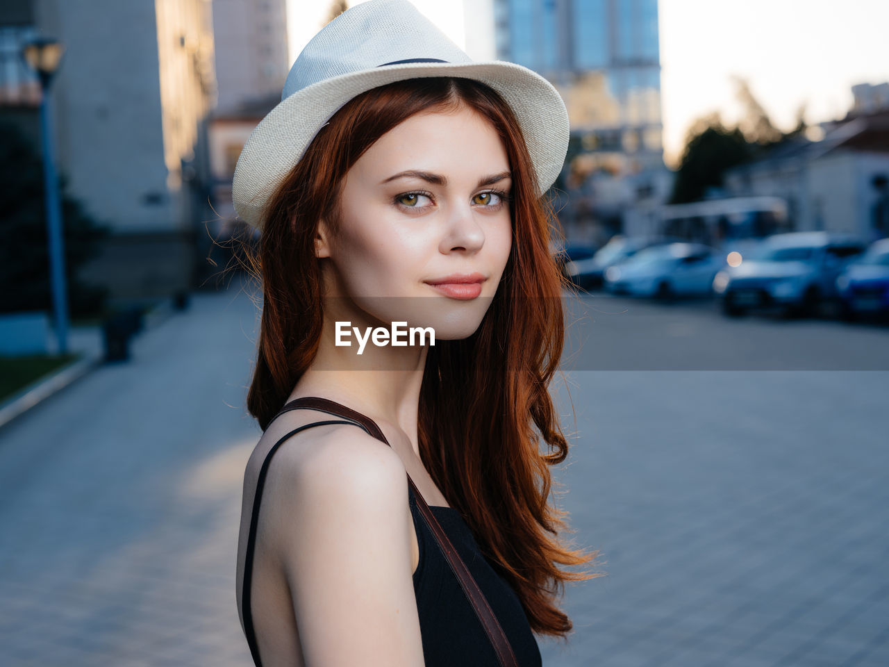 Portrait of beautiful young woman in city