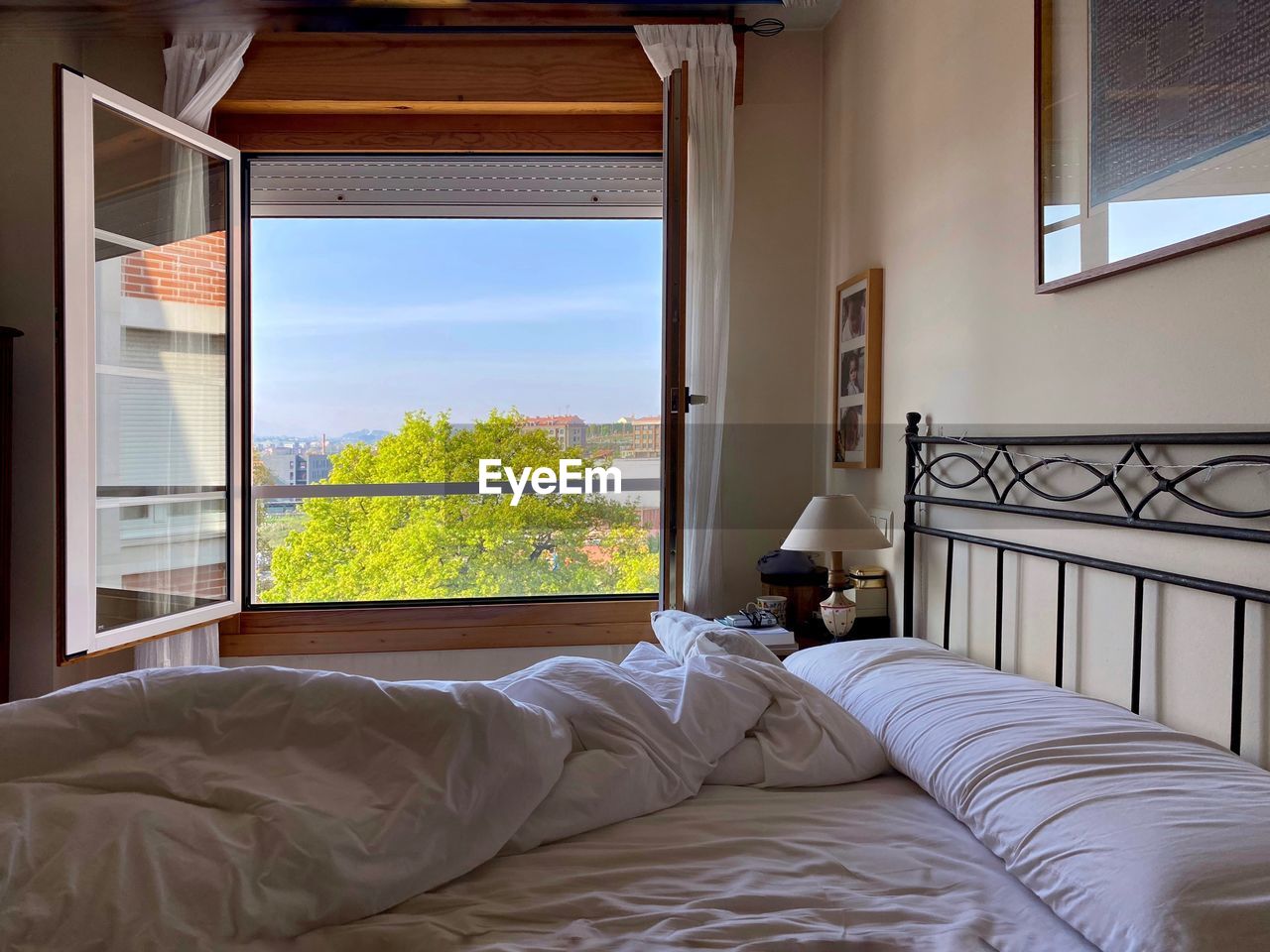 Bedroom interior with opened window