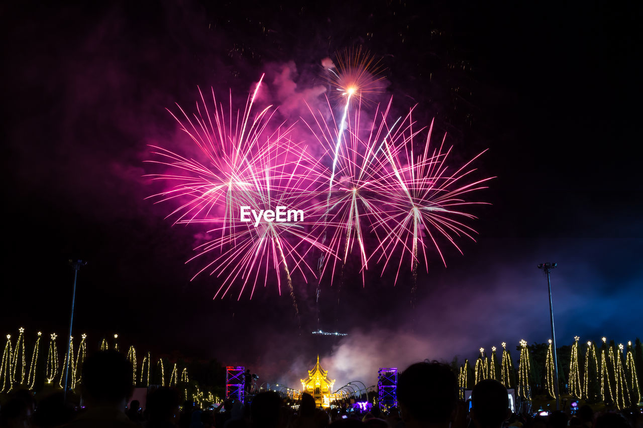 Low angle view of sky illumed with fire crackers