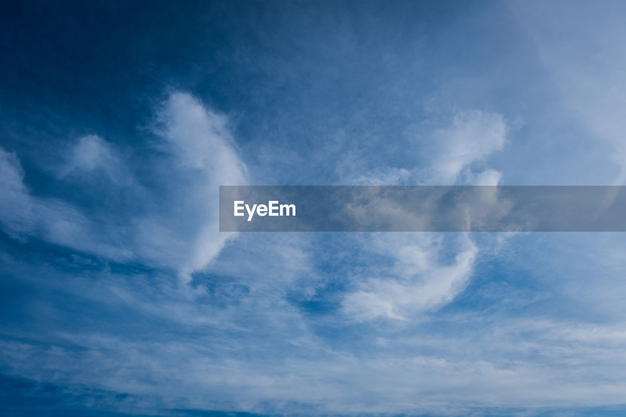 LOW ANGLE VIEW OF CLOUDS IN BLUE SKY